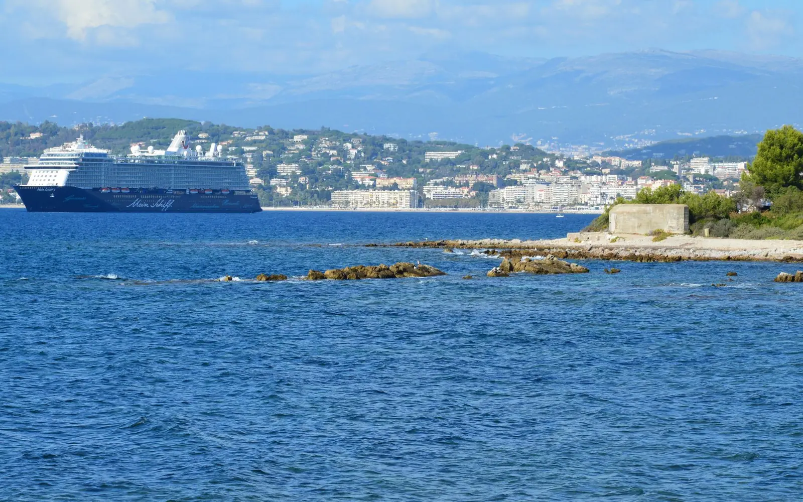Cruise ship off a Mediterranean coastline