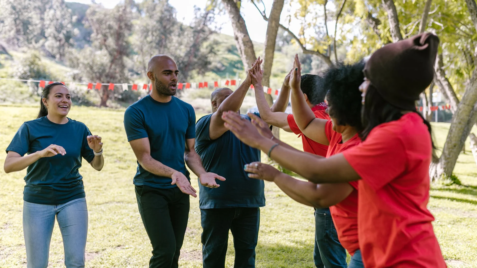 Corporate packages – team celebrating at an outdoor team-building event